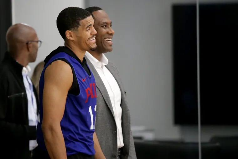 Sixers Tobias Harris, left, and general manager Elton Brand, right, laugh during Sixers practice in Camden, NJ on October 3, 2019.