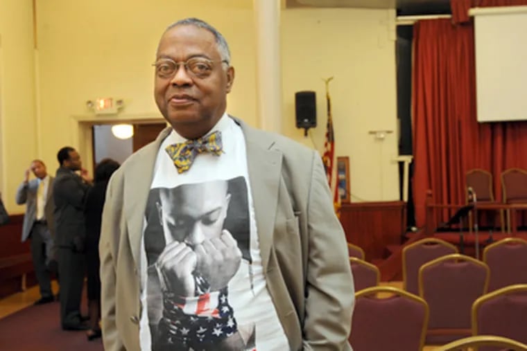 Warren Hamilton wears a T-shirt that says, "Let My People Vote." While any eligible voter will be able to cast a ballot on Nov. 6, that may not be so next time. (April Saul / Staff Photographer)