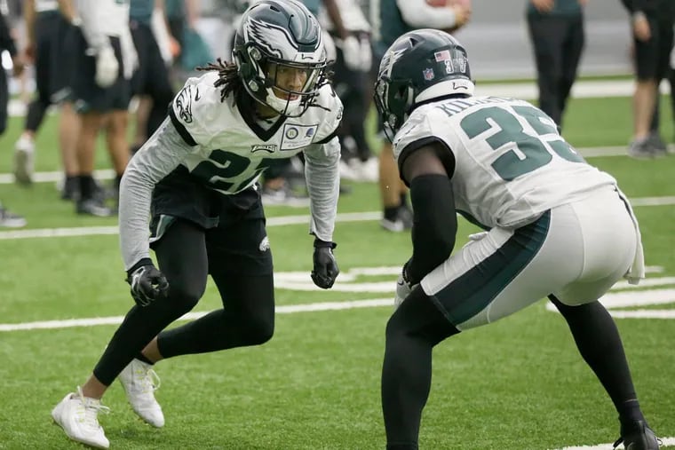 Eagles cornerbacks Sidney Jones (22) and D.J. Killings (35) run a drill during practice at the NovaCare Complex in South Philadelphia on Tuesday, May 22, 2018. Tuesday was the first day of the Eagles' organized team activities.