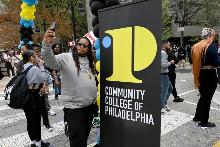 Business major Isaac Kinnard takes a selfie during a block party on campus at Community College of Philadelphia Thursday.  The school was celebrating its new, more than two years in the making, rebranding campaign. CCP, like other community colleges, has lost enrollment over the last few years. College officials hope to lure more students and retain those who do attend.