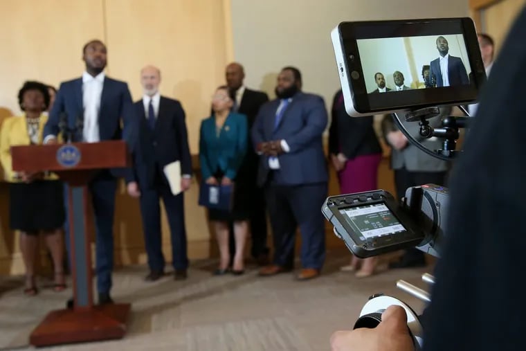 A film crew records rapper Meek Mill speaking during a news conference promoting Gov. Tom Wolf's proposals to reform the criminal justice system at the National Constitution Center on Thursday, May 3, 2018.