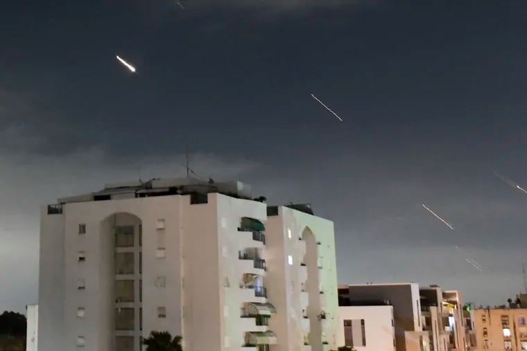 The Israeli Iron Dome air defense system launches to intercept missiles fired from Iran, in central Israel, Sunday. With the attack, Trudy Rubin writes, a decades-long shadow war burst into full view.