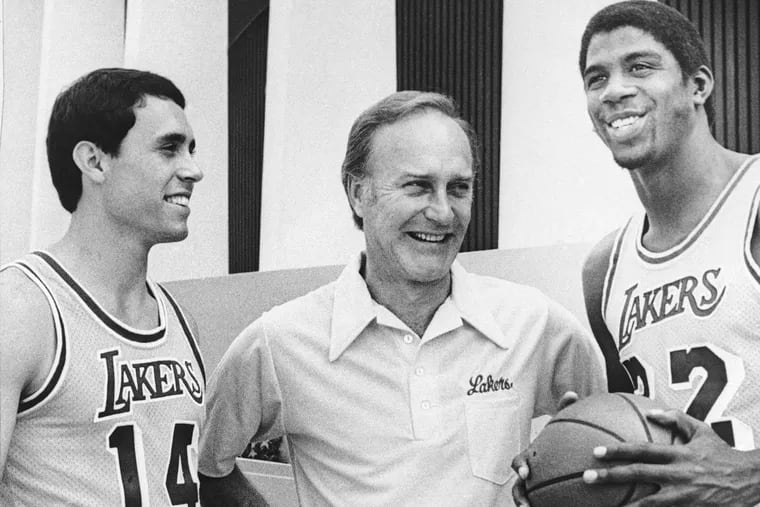 Former St. Joe's coach Jack McKinney with Magic Johnson (right) and Brad Holland during his time coaching the Lakers.