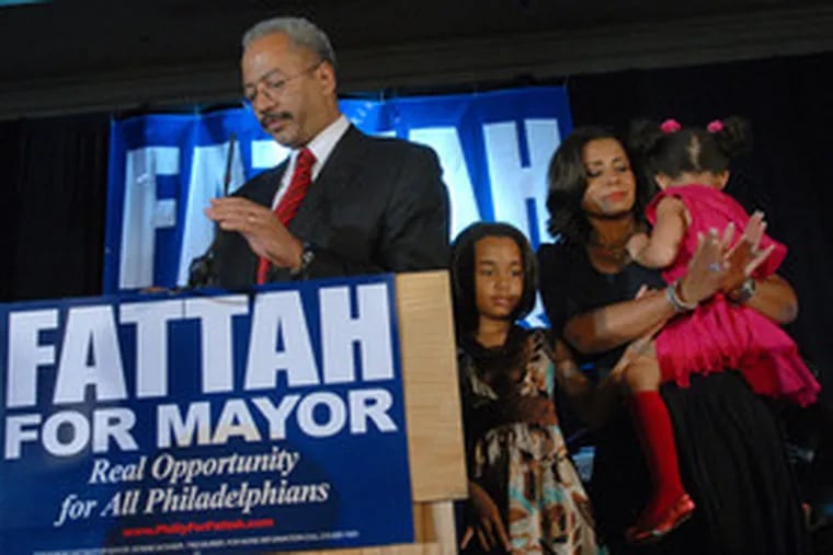 U.S. Rep. Chaka Fattah, with wife Renee Chenault-Fattah holding daughter Chandler, 3, nextto daughter Cameron, 8, concedes the mayoral race at the Sheraton Center City.