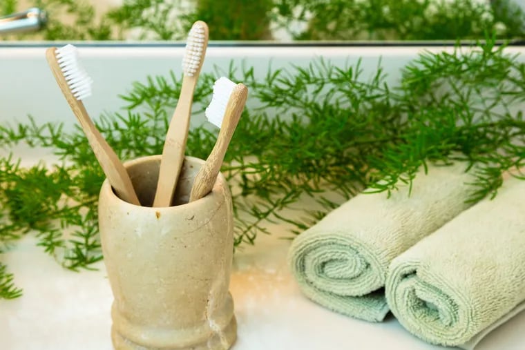 Use an attractive bathroom set or accessories with a cup or tumbler that allows your toothbrushes to stand up without the bristles touching anything else.