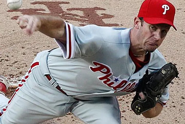 Roy Oswalt pitched six innings and allowed two runs, one earned, against the Mets on Friday. (Frank Franklin II/AP Photo)