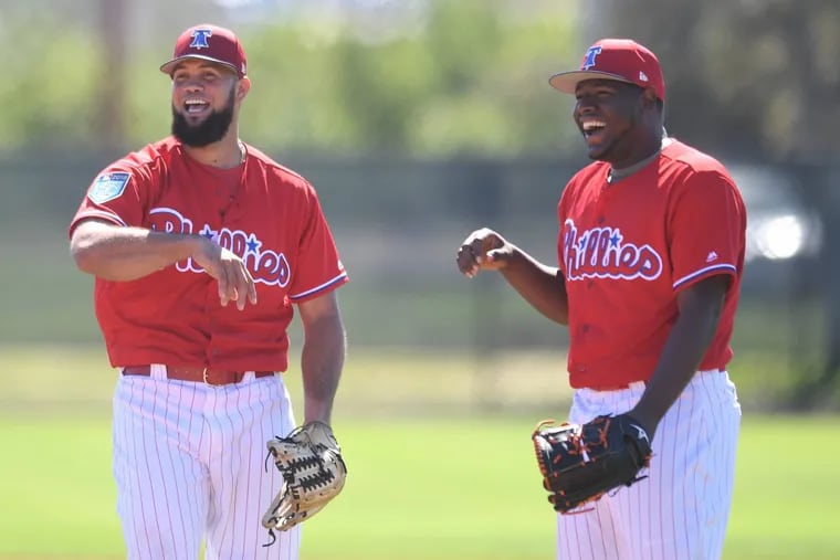 Phillies Luis Garcia, left, and Hector Neris, interact during spring training workouts at Spectrum Field, in Clearwater Florida on Friday, Feb. 17.