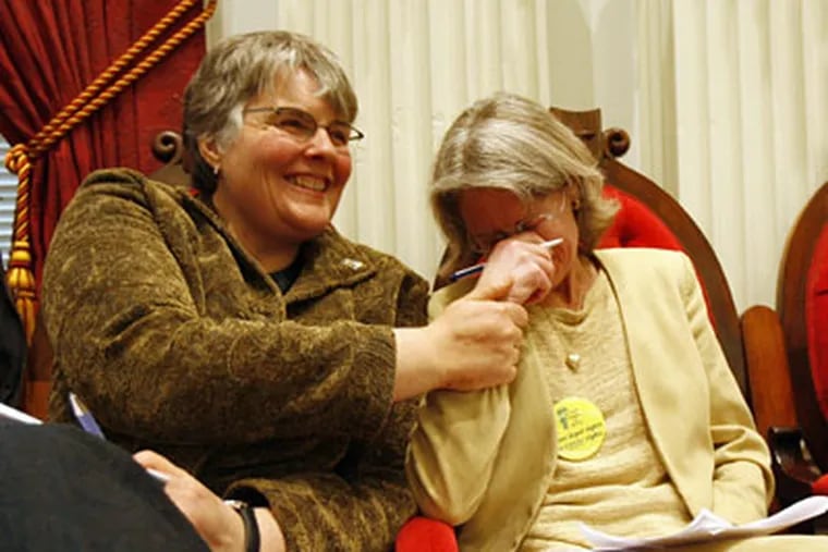Gay marriage advocate Beth Robinson, center, holds back tears following the passage of a gay marriage bill in Montpelier, Vt., Tuesday, overriding Gov. Jim Douglas' veto. Vermont has become the fourth state to legalize gay marriage. (AP Photo / Toby Talbot)