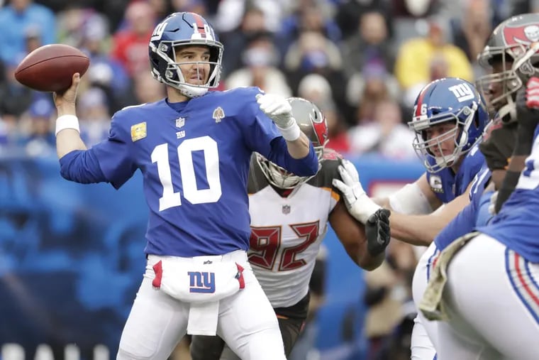 New York Giants quarterback Eli Manning throws during the first half of an NFL football game against the Tampa Bay Buccaneers, Sunday, Nov. 18, 2018, in East Rutherford, N.J. (AP Photo/Julio Cortez)