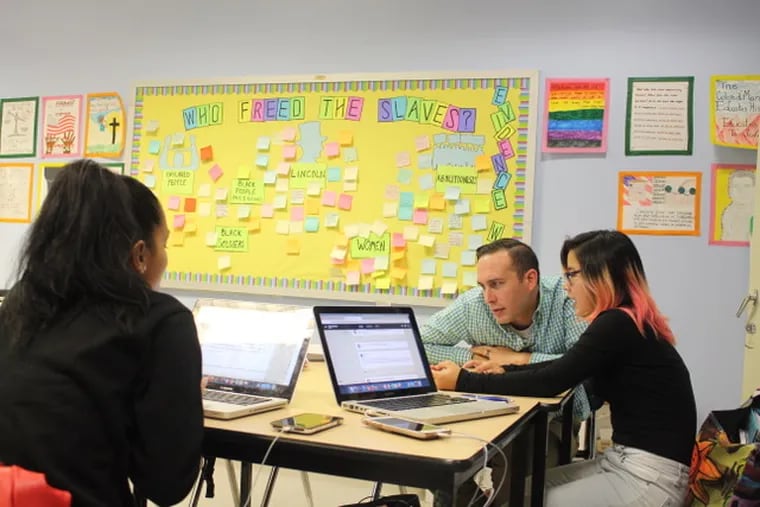 Teacher Adam Sanchez and some of his students in their classroom in New York City. This year, Sanchez moved to Philadelphia to teach at Lincoln High School.