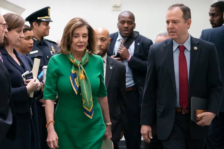 Speaker of the House Nancy Pelosi, D-Calif., joined by House Intelligence Committee Chairman Adam Schiff, D-Calif., leaves a lengthy closed-door meeting with the Democratic Caucus at the Capitol in Washington, Tuesday, Jan. 14, 2020.