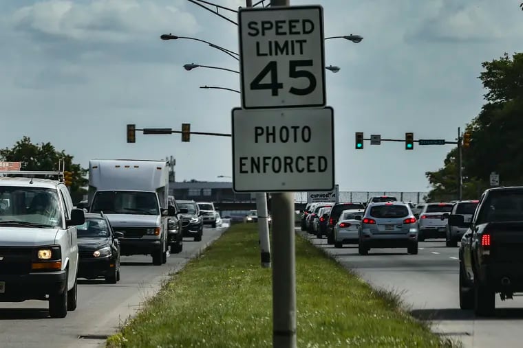 Sign warning Roosevelt Boulevard drivers of photo enforcement for speed limits.
