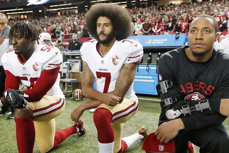 Former San Francisco quarterback Colin Kaepernick (No. 7) triggered a national debate by taking a knee during the national anthem and more than a year later it rages on.