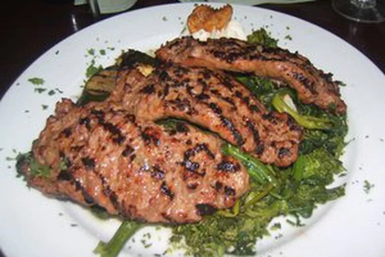 The grilled homemade Italian sausage served over broccoli rabe, at $15.95, had lovely color and flavor contrast. It was the favored entree.