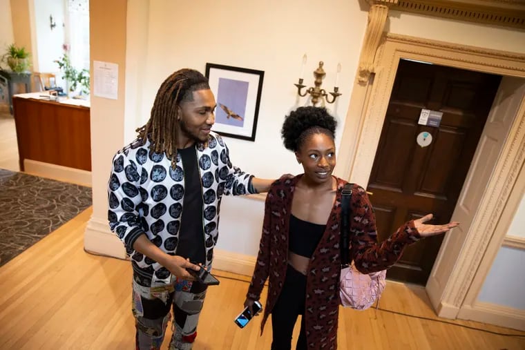 Kyle Woodland talks with model Amaya Arletta during a rehearsal for the spring fashion show hosted by KWS Productions at Hill Top Preparatory School in Bryn Mawr, Pa. on Sunday, April 21, 2024. The show is Saturday, April 27, at 7 p.m. at the Hill Top school.