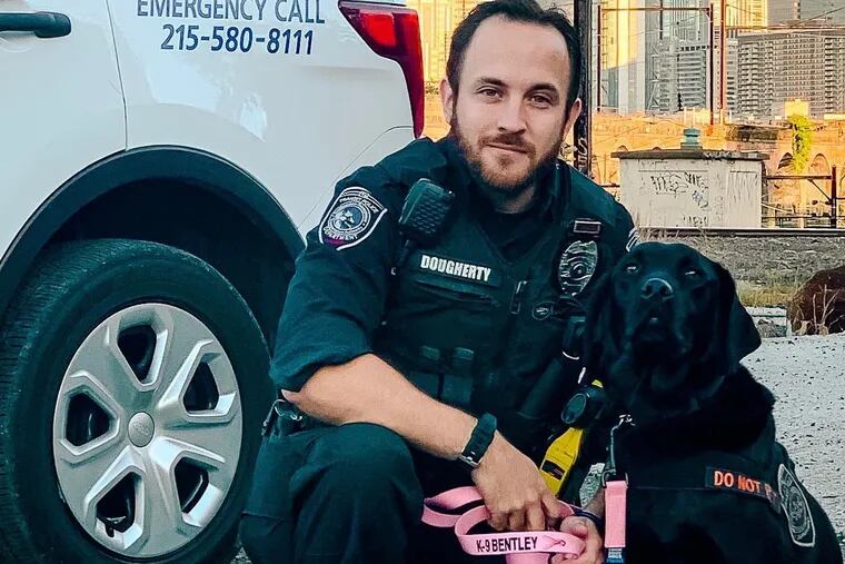 SEPTA Police K9 officer Kevin Dougherty poses with his partner in crime-busting, K9 Bentley, who specializes in TSA explosive-detection.