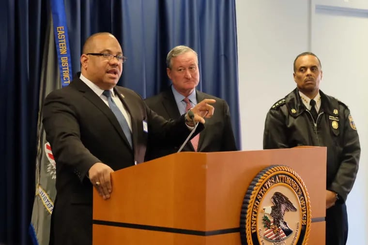 Acting Department of Justice, Office of Community Oriented Policing Services (COPS) Director Ronald Davis conducts a press conference on the Interim Final Report of the Philadelphia Police Department’s efforts in the collaborative reform initiative. Ronald Davis, Mayor Jim Kenney and police Commissioner Richard Ross listen.