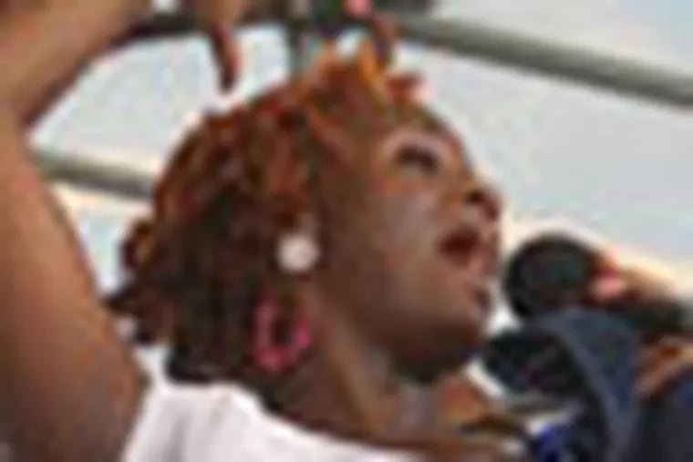 Treena Ferebee is joined by other member of the choir as the belt out their last song. Taste of Philadelphia which will include the Formation of a performance of Gospel Choir memebers singer from around the City at Penn's Landing on Sunday July 1, 2012.   ( RON CORTES / STAFF PHOTOGRAPHER ).