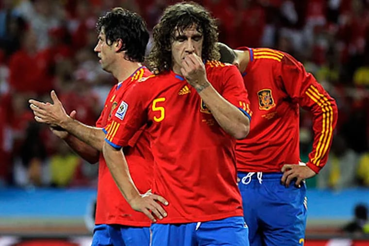 Spain was upset by Switzerland in its opening World Cup game. (Julie Jacobson/AP)