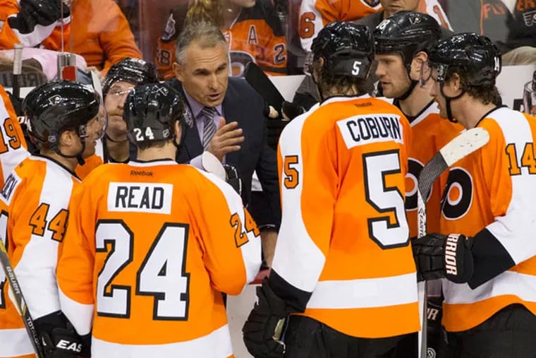 Craig Berube talks things over with his team during the third period of an NHL hockey game against the Winnipeg Jets, Friday, Nov. 29, 2013, in Philadelphia. The Flyers win 2-1. (Chris Szagola/AP file)