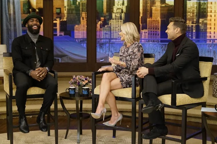 Kelly Ripa and Ryan Seacrest talk with Malcolm Jenkins during the production of &quot;Live with Kelly and Ryan&quot;