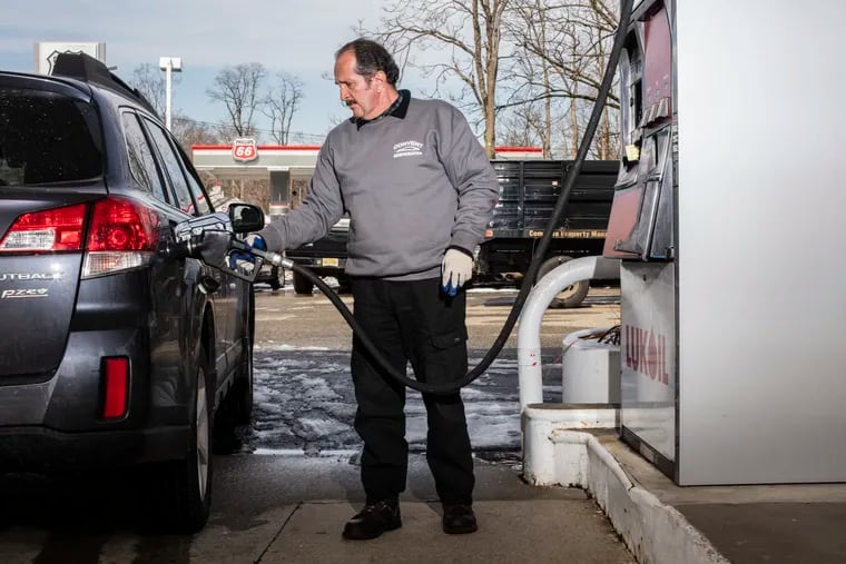 An attendant pumps gas at a Lukoil gas station in Morristown, N.J., in March.