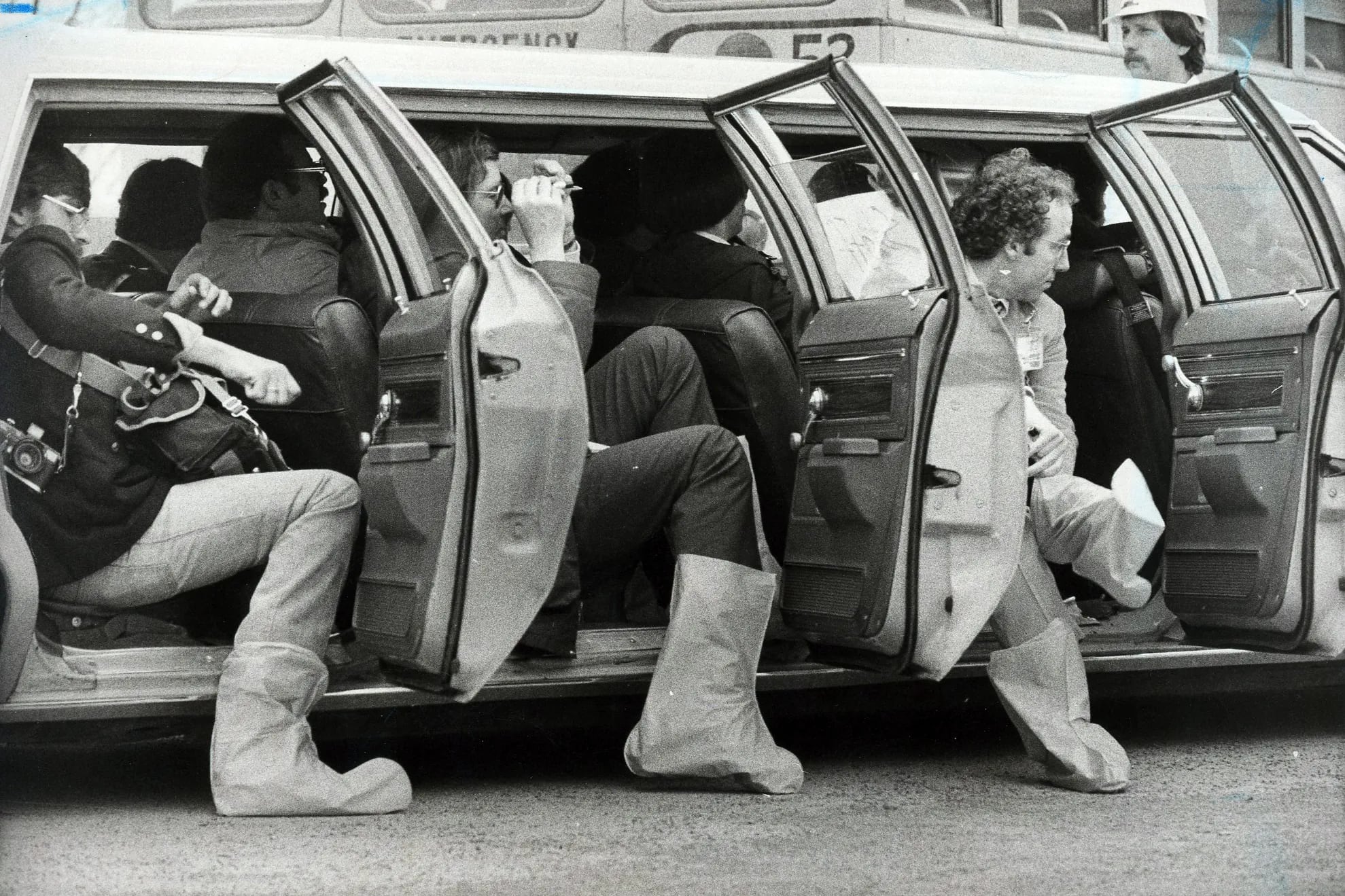 Members of the media put on booties before entering the Three Mile Island nuclear power plant in 1979.