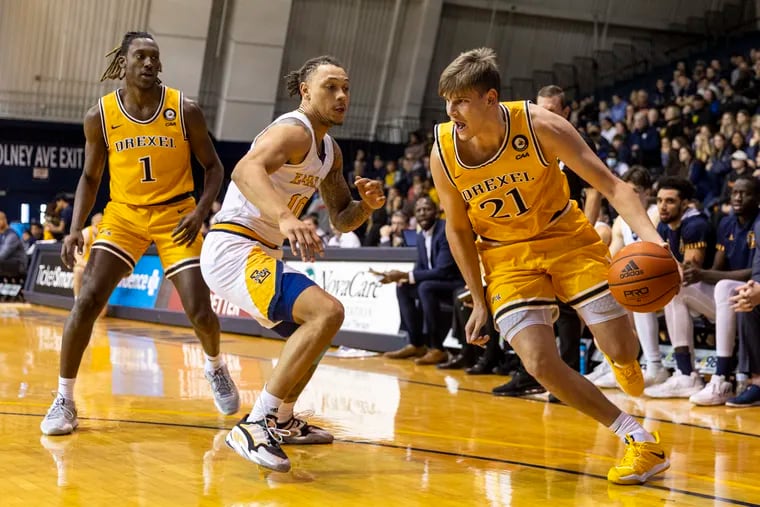 Drexel forward Mate Okras drives against La Salle's Josh Nickelberry at Tom Gola Arena on Dec. 10. The Dragons head into conference play with a 6-6 record.