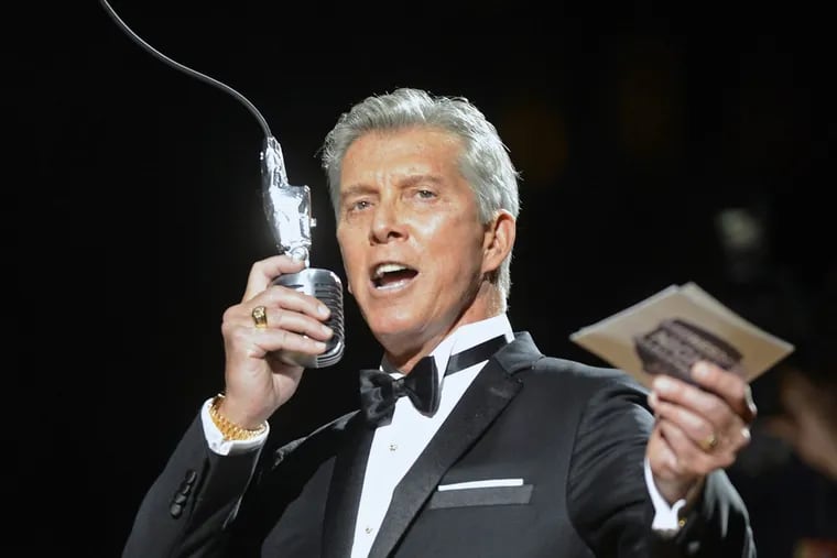Boxing announcer Michael Buffer welcomes the crowd to the game between the Charlotte Bobcats and New York Knicks at Time Warner Cable Arena on Wednesday, December 5, 2012, in Charlotte, North Carolina.