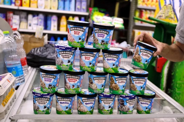 A man buys Ben & Jerry's ice cream in Jerusalem on July 20, 2021. - American ice cream-maker Ben & Jerry's announced on July 19, 2021 they would stop selling their ice cream in the occupied Palestinian territories, saying its sale "is inconsistent with our values."