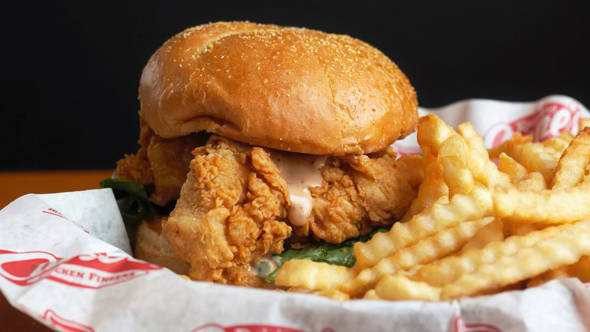 Raising Cane's chicken sandwich is really just a bun with a few fingers tossed on top.