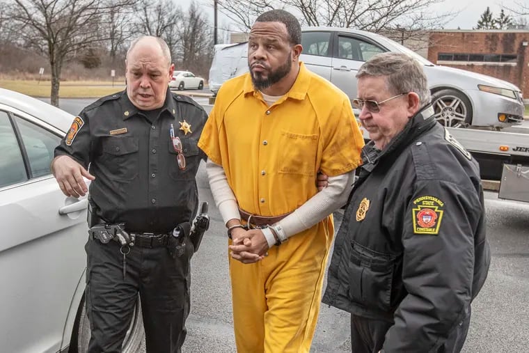 Pennsylvania State Constables lead Miles K. Jones, 41, into Bucks County District Court in Quakertown on Tuesday, Feb. 4, 2020. Jones, of North Philadelphia, is accused of killing Eric Braxton, 41, and Arthur Hill, 46, both of Philadelphia, at an Upper Bucks County campground last fall.