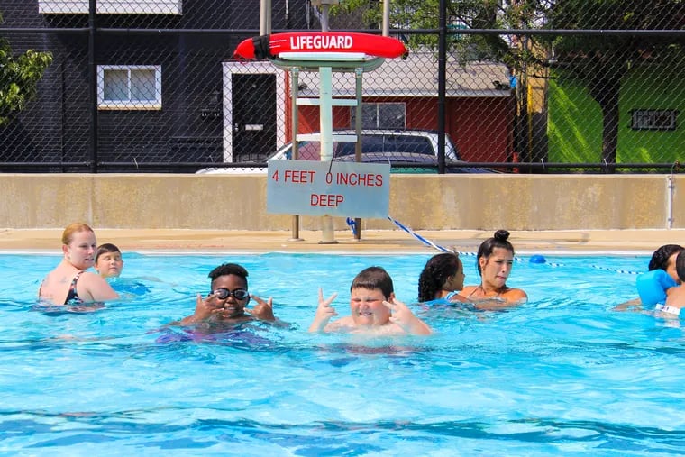 Campers enjoy the pool at Murphy Recreation Center in South Philadelphia in July 2018.