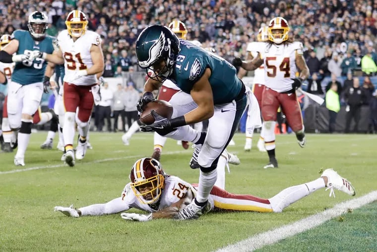 Eagles wide receiver Golden Tate scores a two-point conversion against Washington cornerback Josh Norman in the fourth-quarter on Monday, December 3, 2018 in Philadelphia.