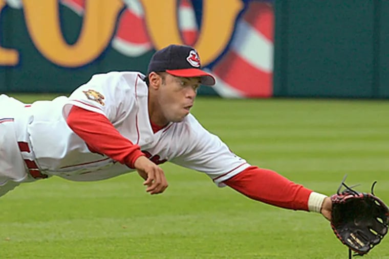Cleveland Indians second baseman Roberto Alomar dives but can't get to a ball during the 2001 season. (AP Photo/Mark Duncan)