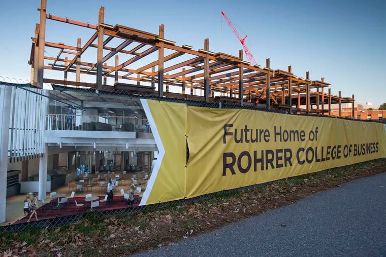 A new business school building under construction at Rowan University in 2015. Stockton University's first, failed plan for an Atlantic City campus at the Showboat site was driven by a desire to get ahead of Rowan.