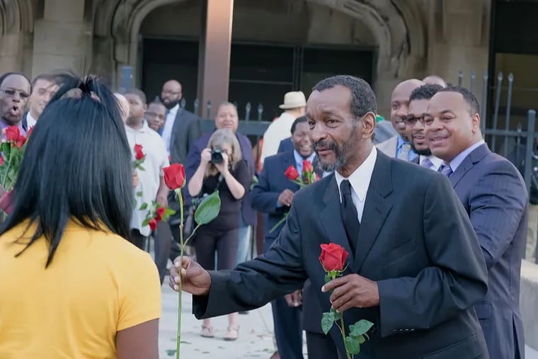 Tuesday, September 8, 2015 A group of Camden activists arranged for a number of local men to greet the Camden High School students on their first day of school and hand out roses Tuesday, September 8, 2015. ( ED HILLE / Staff Photographer )