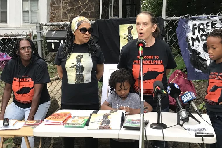 At a press conference on the sidewalk outside the MOVE house on Kingsessing Street, Sue Africa talks about Ramona Africa's cancer.