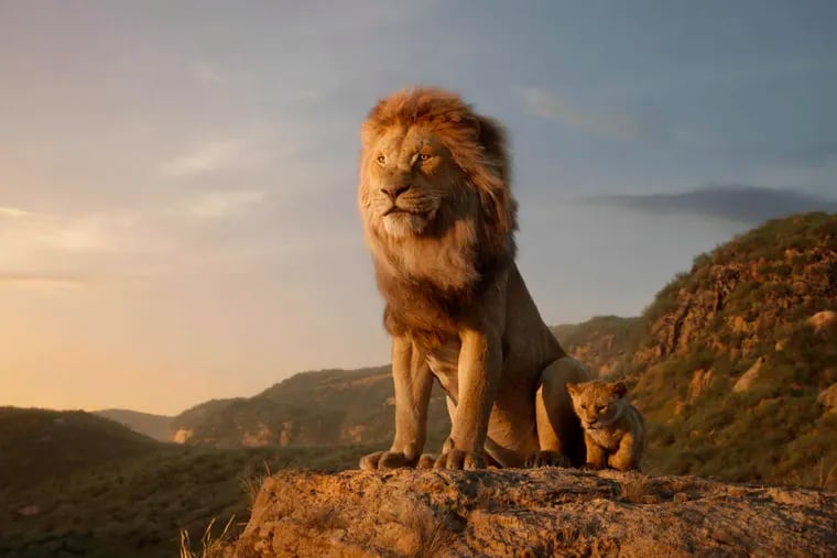 This image released by Disney shows characters, from left, Mufasa, voiced by James Earl Jones, and young Simba, voiced by JD McCrary, in a scene from "The Lion King."