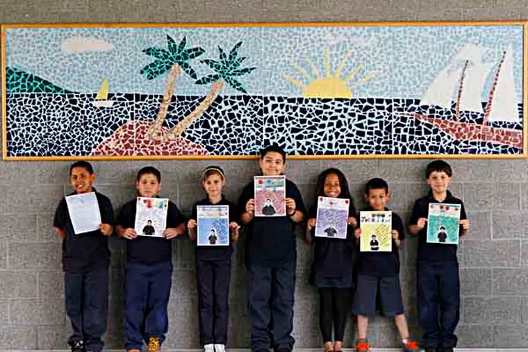 From left, Raul Ortiz, Ryan Llanos, Camila Solivah, Ismael Rivera, Damaris Davis, Justin Rivera, and Jacob Davil, students in Hillary Linardopoulos' third grade class at Julia de Burgos Elementary, hold the letters that they wrote to Vice President Joe Biden. Biden answered some of their letters in his audio series. ( MICHAEL S. WIRTZ / STAFF PHOTOGRAPHER ). May 17, 2013.