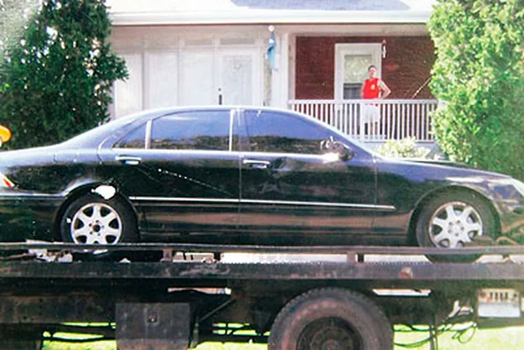 A 2000 Mercedes Benz that police believe was involved in the death of Faith Sinclair in a hit and run accident Sunday night, is towed away from 312 S. Fairview Ave in Upper Darby.