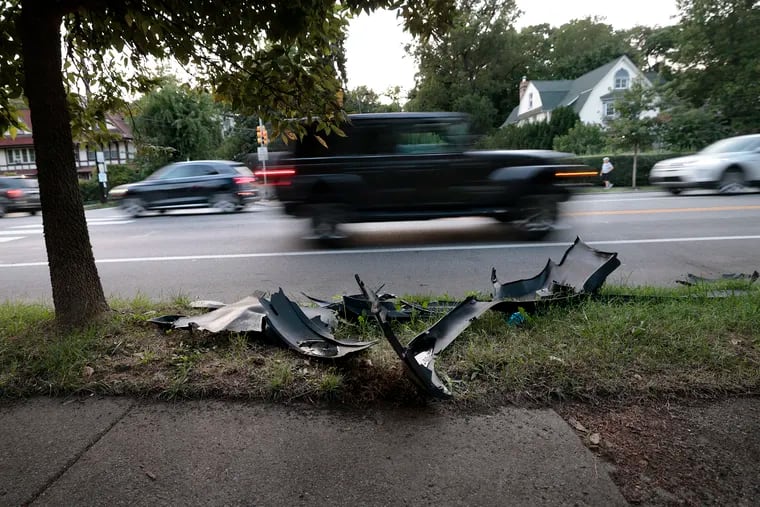 Part of a vehicle along Lincoln Drive near Greene Street last year. Residents want to reduce speeding, aggressive driving and near-daily crashes on and near Lincoln Drive, which has hairpin curves and passes through dense neighborhoods.