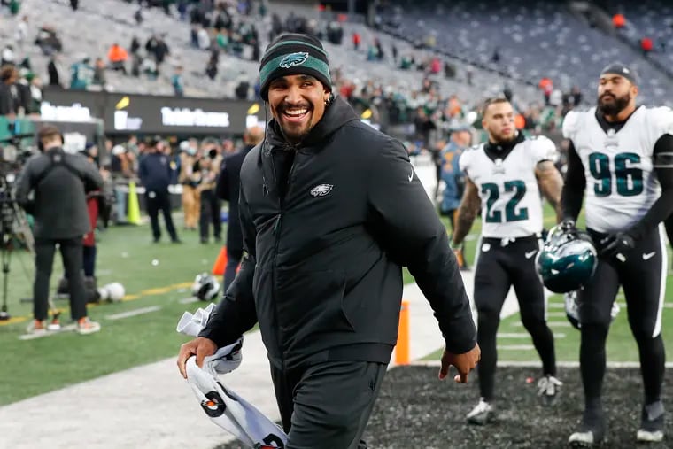 Eagles quarterback Jalen Hurts smiles walking off the field after the Eagles beat the New York Jets on Sunday, December 5, 2021 at MetLife Stadium in East Rutherford, New Jersey.