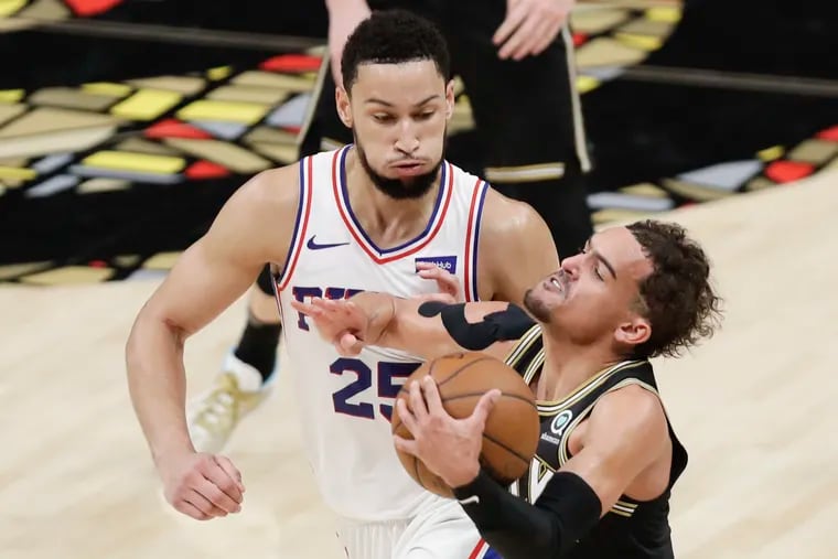 Sixers guard Ben Simmons fouls  Hawks guard Trae Young during the third quarter of Game 4 in Atlanta.