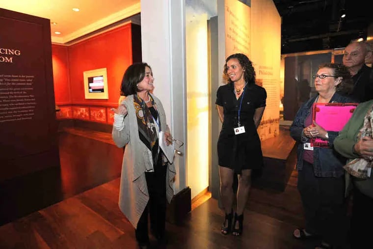 Adele Fine (left) leads a practice tour as other docents, includ-ing Rosangela Gomes (center), listen and take notes. The guides have learned the sweep of Jewish American history from 1654 to the present - and done homework.