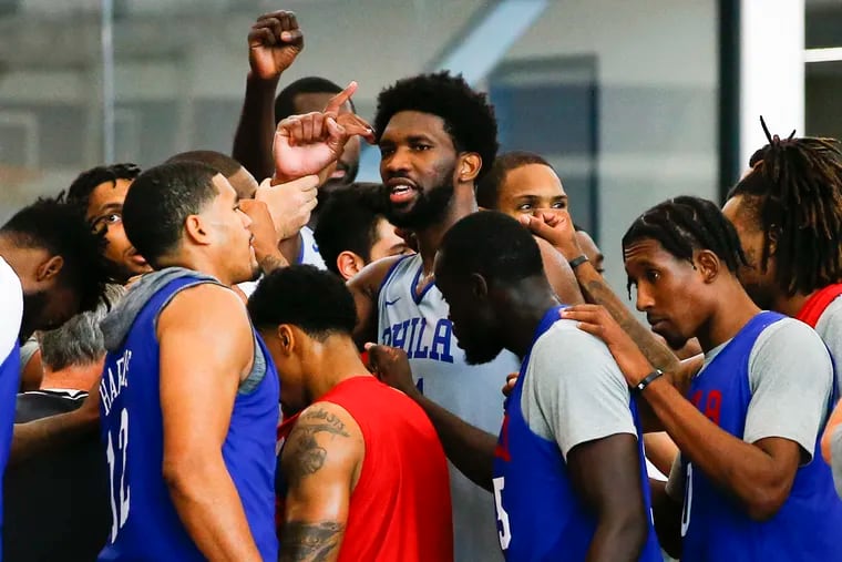 Sixers center Joel Embiid brings the team together after a recent practice.
