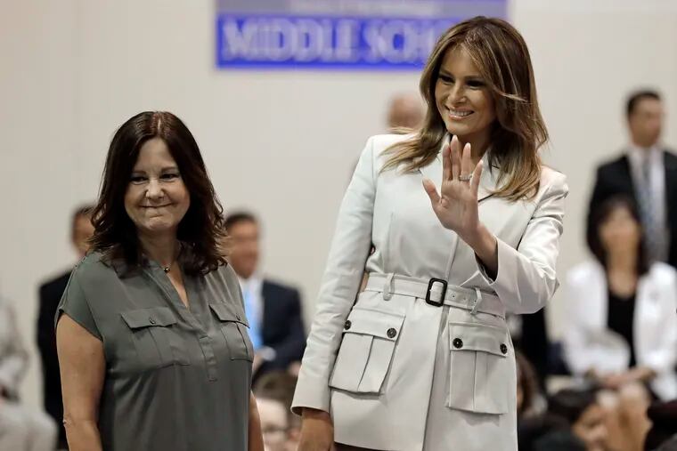 First lady Melania Trump, right, and second lady Karen Pence, left, greet students at Albritton Middle School in Fort Bragg, N.C., Monday, April 15, 2019. (AP Photo/Chuck Burton)