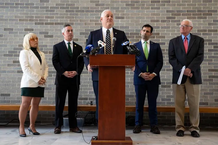 (left to right) County Commissioners Diane M. Ellis-Marseglia and Robert J. Harvie Jr, District Attorney Matt Weintraub, Solicitor Joe Khan and County Commissioner Gene DiGirolamo stand during a press conference at the Bucks County Administration Building in Doylestown.