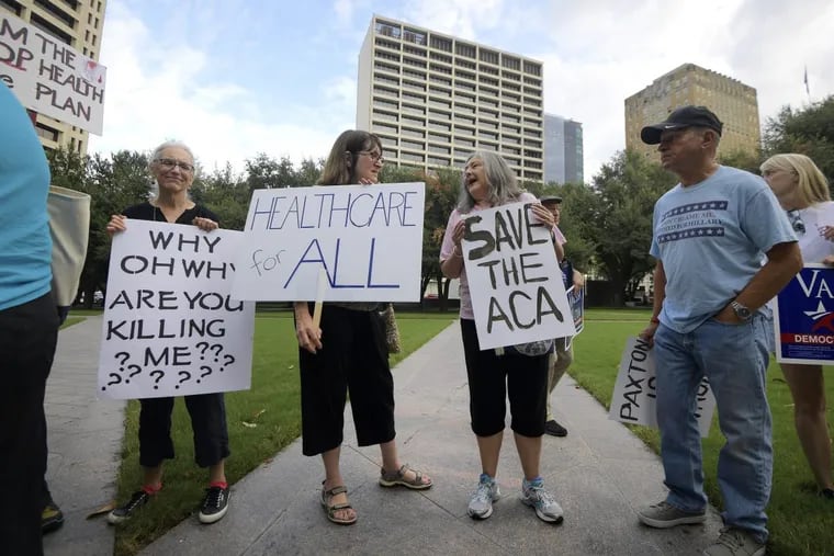 Supporters of the Affordable Care Act protest during a rally at Burnett Park in Fort Worth, Texas, Wednesday, Sept. 5, 2018. Democratic nominee for Texas Attorney General Justin Nelson hosted the Fort Worth Rally for Preexisting Coverage Protection.