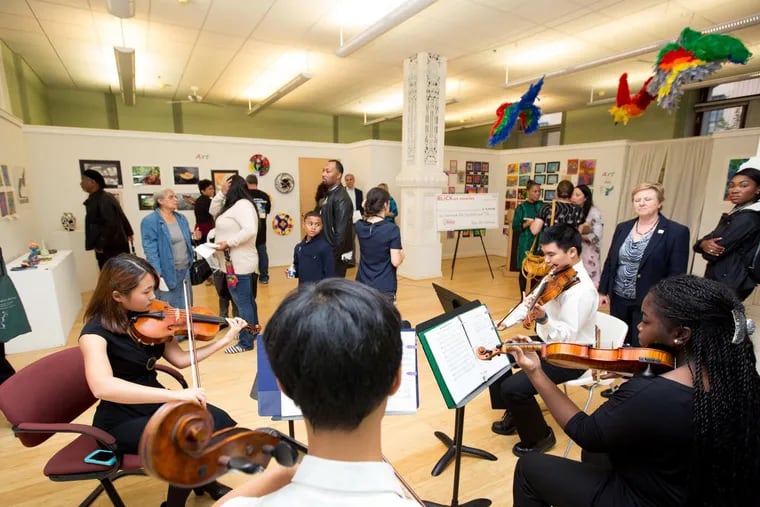 The Philadelphia School District All-City string quartet from performs in the art gallery at City Hall Friday, September 30, 2016. Work from district students hung on the walls in the gallery and Mayor Kenney congratulated teachers and students for their work.